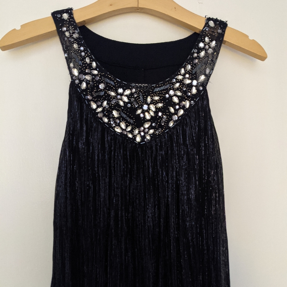 Navy blue knee length dress with silver detail, sleeveless, with beading details